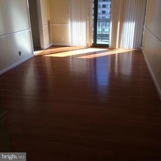 5505 Seminary Road, Unit 1701N Falls Church, VA 22041 - Photo 2 of 20 an empty room with wooden floor and windows