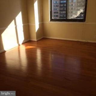 5505 Seminary Road, Unit 1701N Falls Church, VA 22041 - Photo 11 of 20 a view of an empty room with wooden floor and a window
