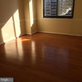 5505 Seminary Road, Unit 1701N Falls Church, VA 22041 - Photo 12 of 20 a view of an empty room with wooden floor and a window
