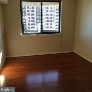 5505 Seminary Road, Unit 1701N Falls Church, VA 22041 - Photo 17 of 20 a view of an empty room with wooden floor and a window