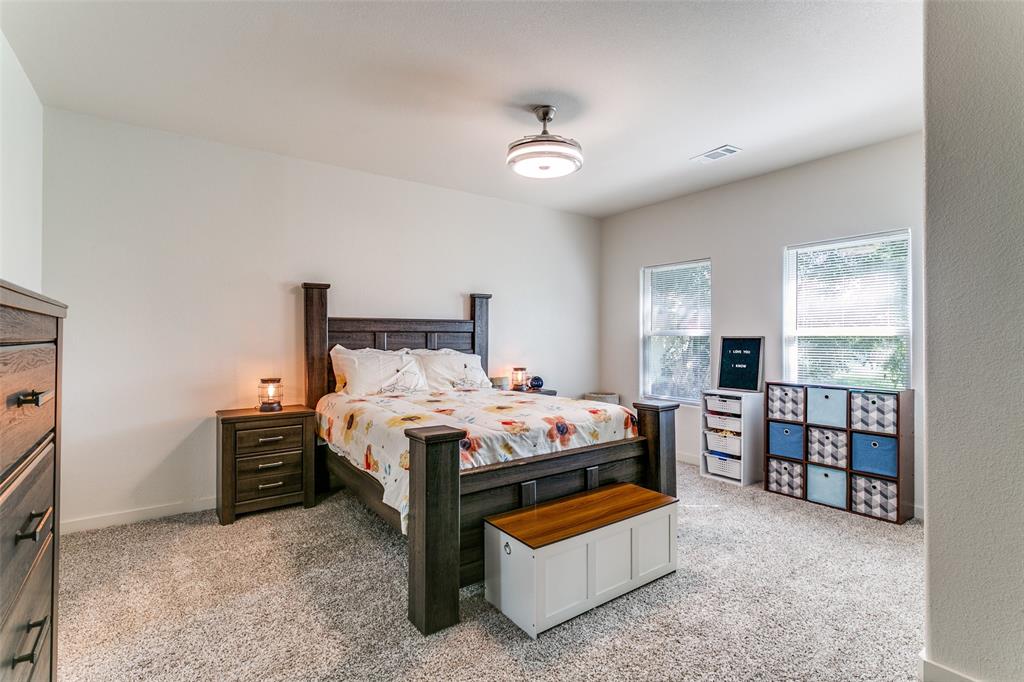 1108 South Morris Street Gainesville, TX 76240 - Photo 12 of 23 a bed room with a bed and a tv