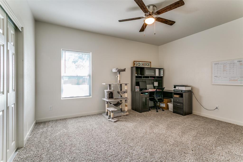 1108 South Morris Street Gainesville, TX 76240 - Photo 18 of 23 a view of a workspace with furniture and a window