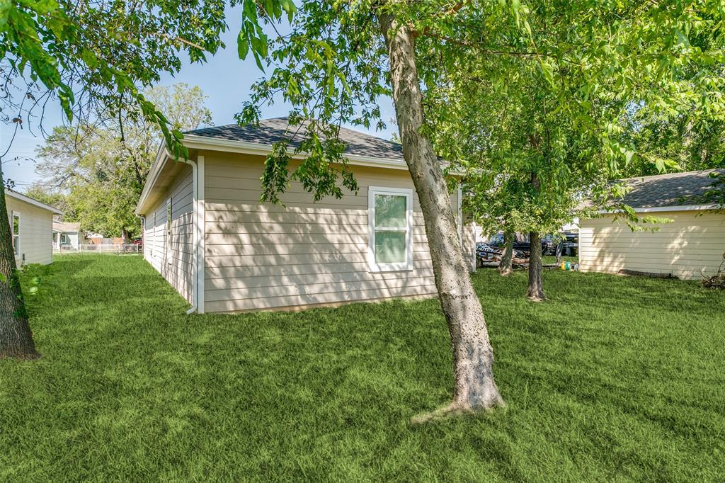 1108 South Morris Street Gainesville, TX 76240 - Photo 22 of 23 a view of a house with a yard