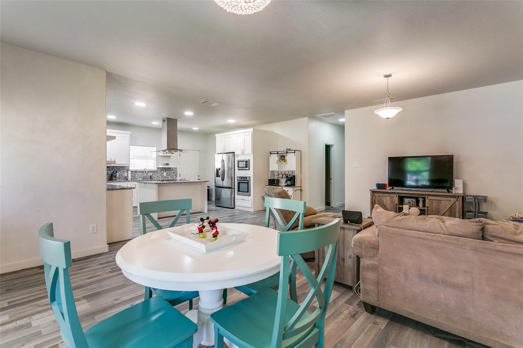 1108 South Morris Street Gainesville, TX 76240 - Photo 8 of 23 a view of a dining room with furniture