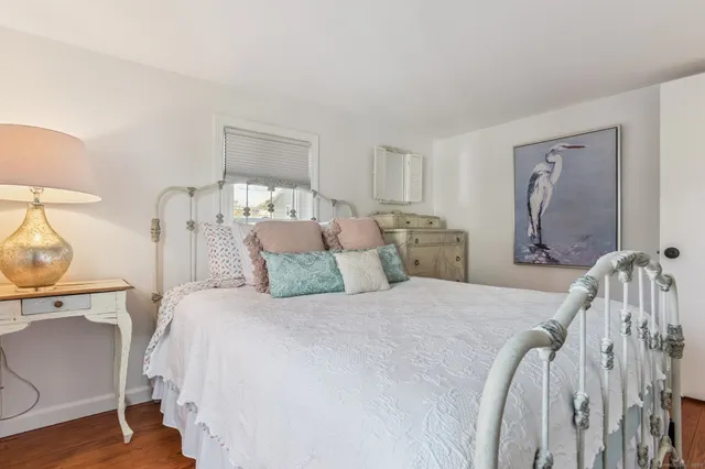 a bed room with a bed and a night stand