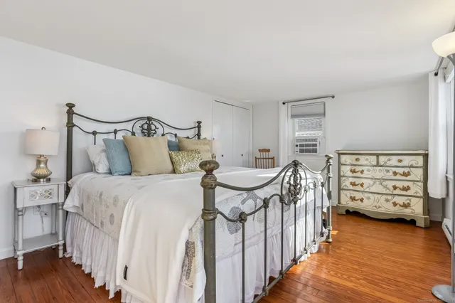 a bedroom with a bed and a tv