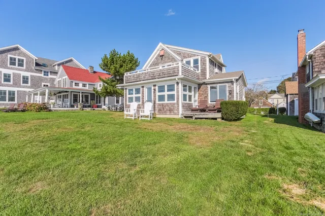 a front view of a building with a garden
