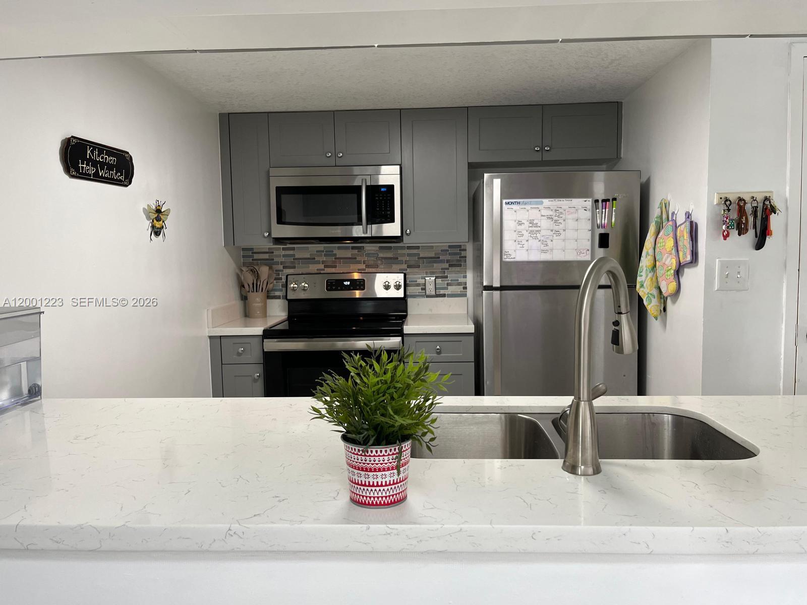 280 Southwest 20th Road, Unit 504 Miami, FL 33129 - Photo 13 of 23 a living room with furniture and a flat screen tv