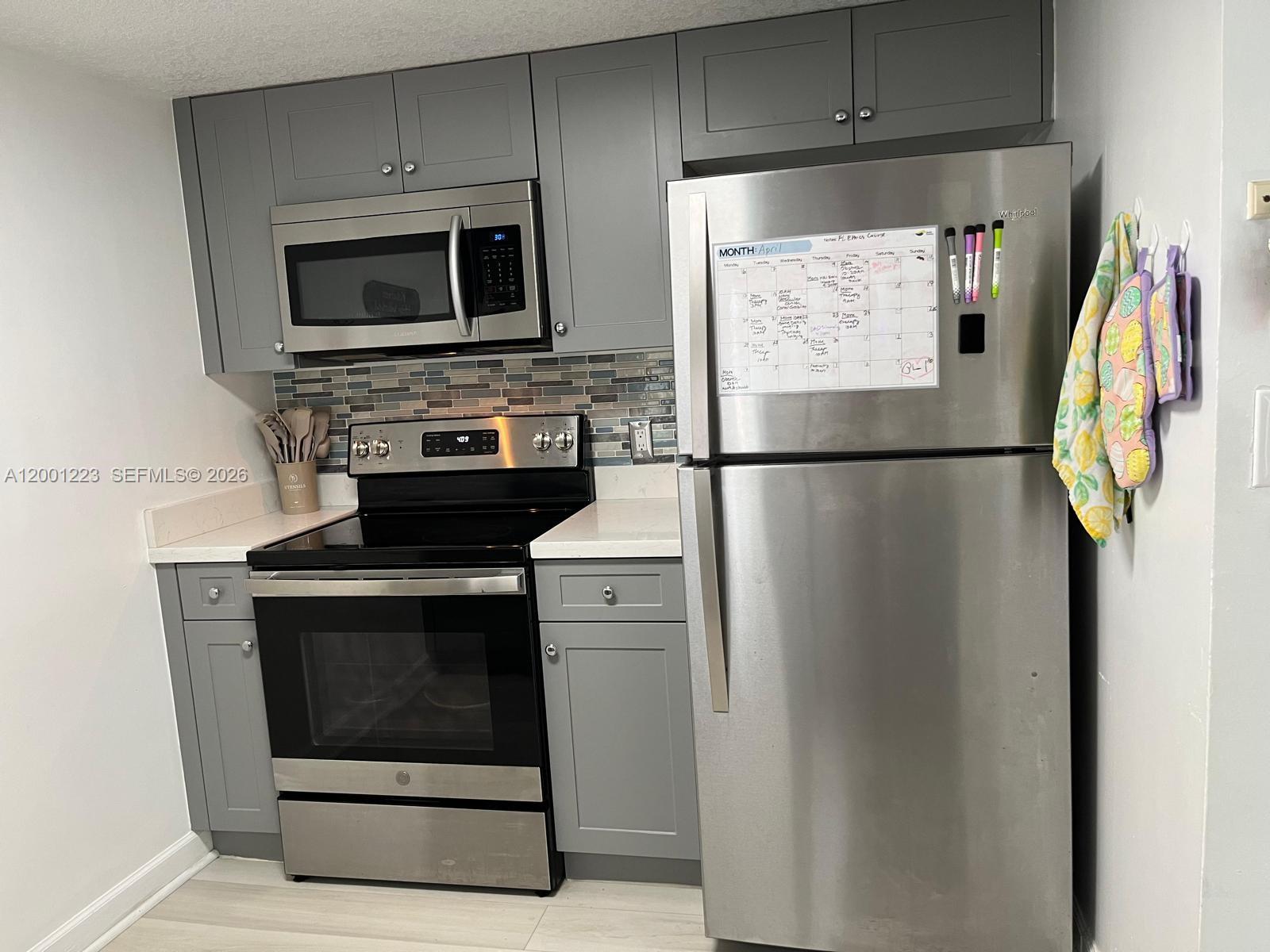 280 Southwest 20th Road, Unit 504 Miami, FL 33129 - Photo 14 of 23 a kitchen with a refrigerator stove and microwave