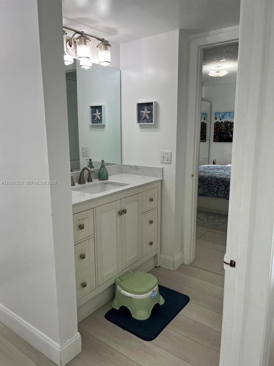 280 Southwest 20th Road, Unit 504 Miami, FL 33129 - Photo 20 of 23 a bathroom with a sink and a mirror