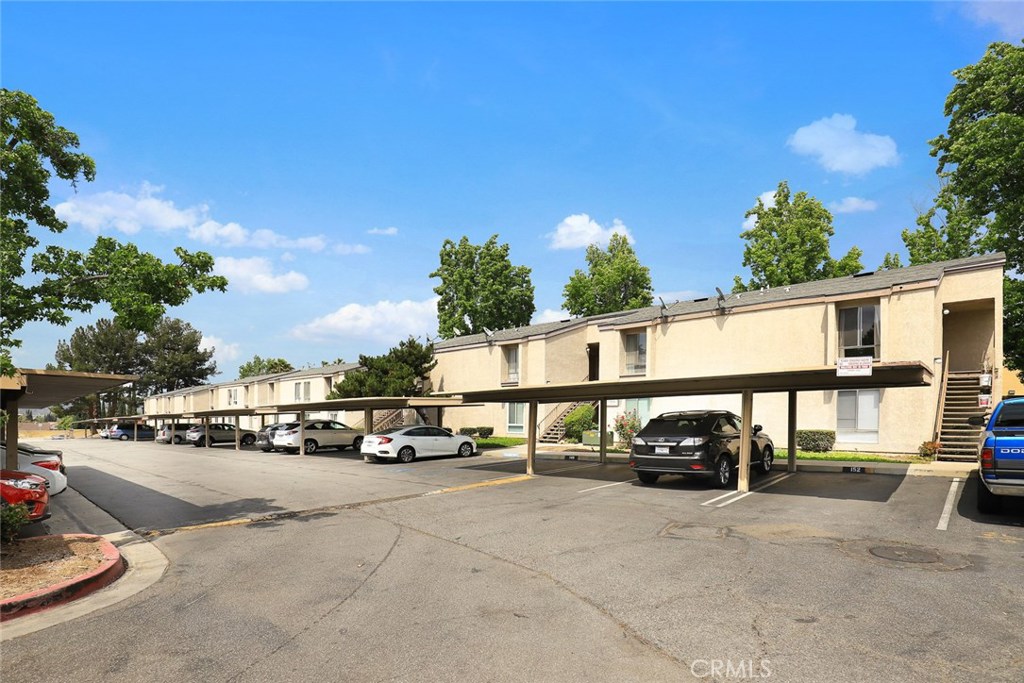 17034 Colima Road, Unit 128 Hacienda Heights, CA 91745 - Photo 1 of 1 a view of street with parked cars