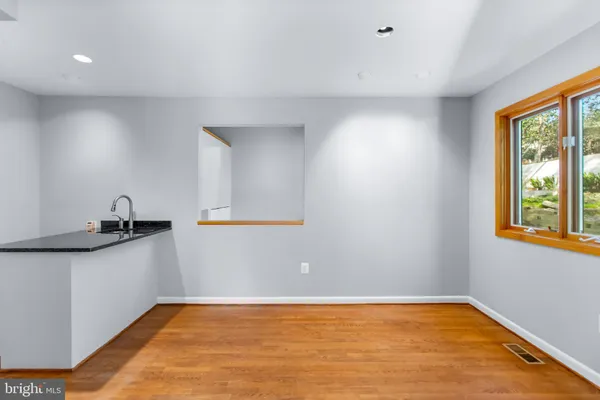 a bathroom with a shower and a window
