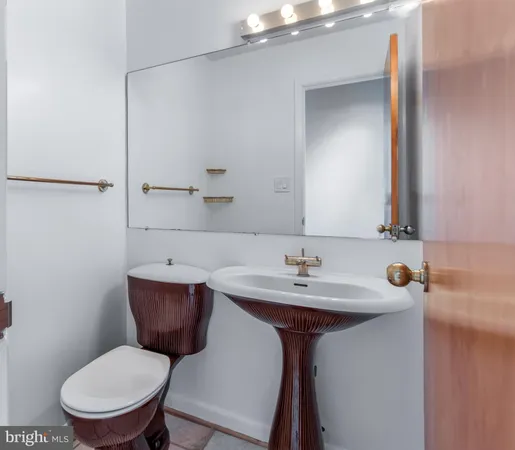 a large kitchen with stainless steel appliances kitchen island a large counter top and a stove top oven