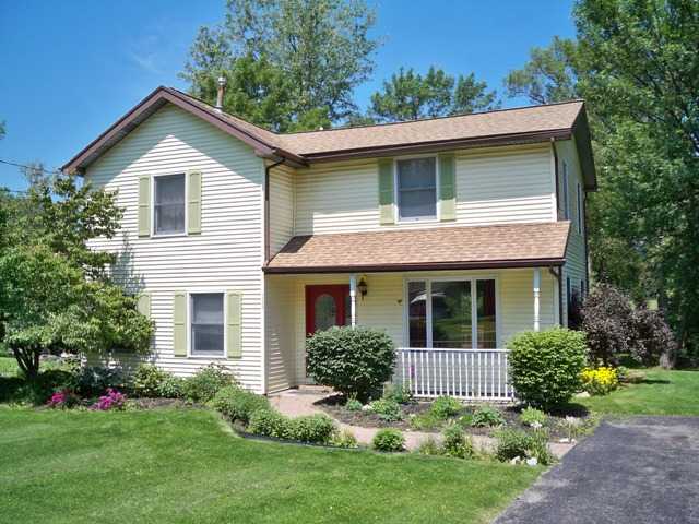 7243 Furnace Road Ontario, NY 14519 - Photo 1 of 1 Exterior Front Summer view of the house