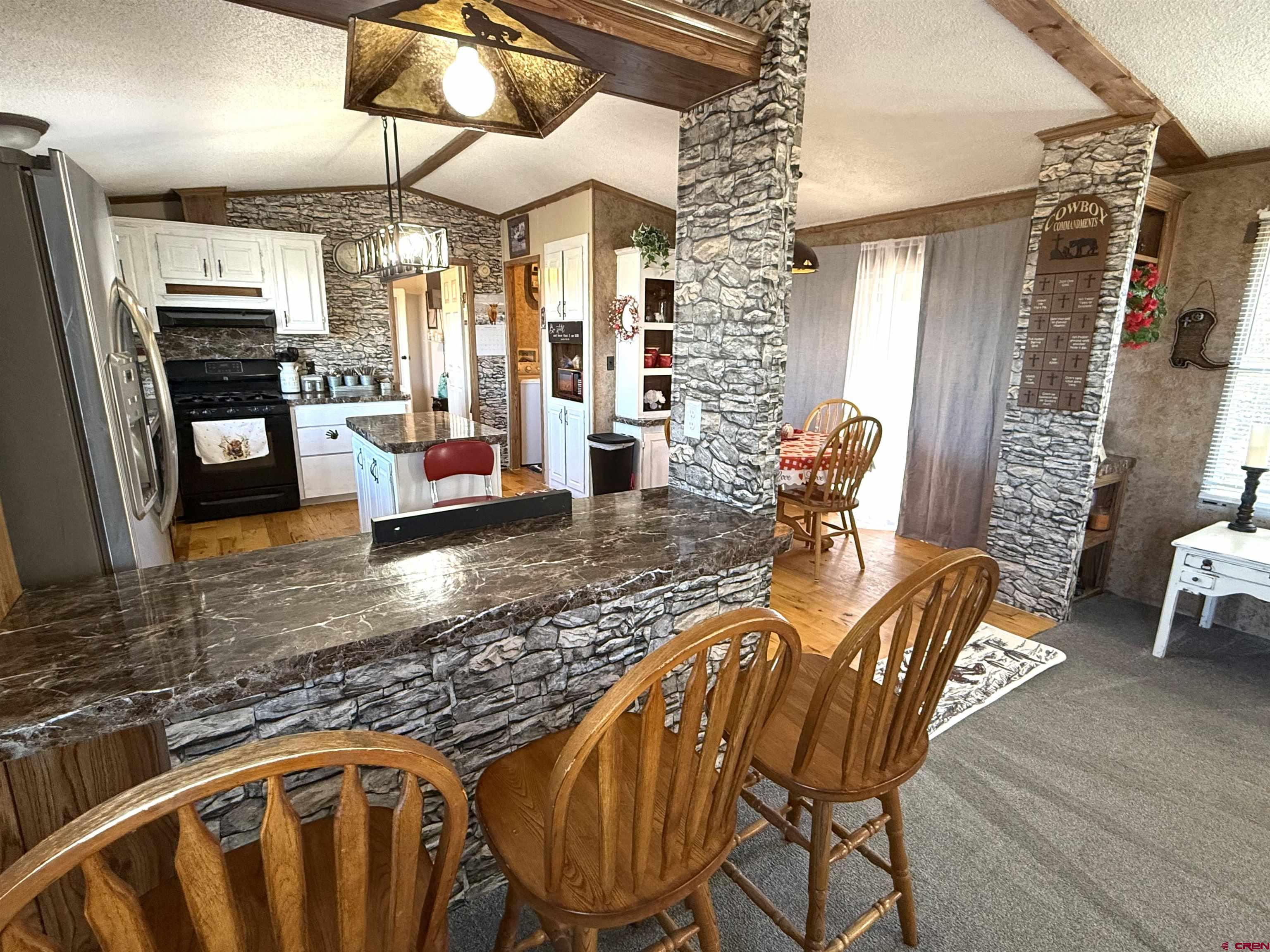 15546 Rd BB Pleasant View, CO 81331 - Photo 14 of 29 a living room with patio furniture and a window
