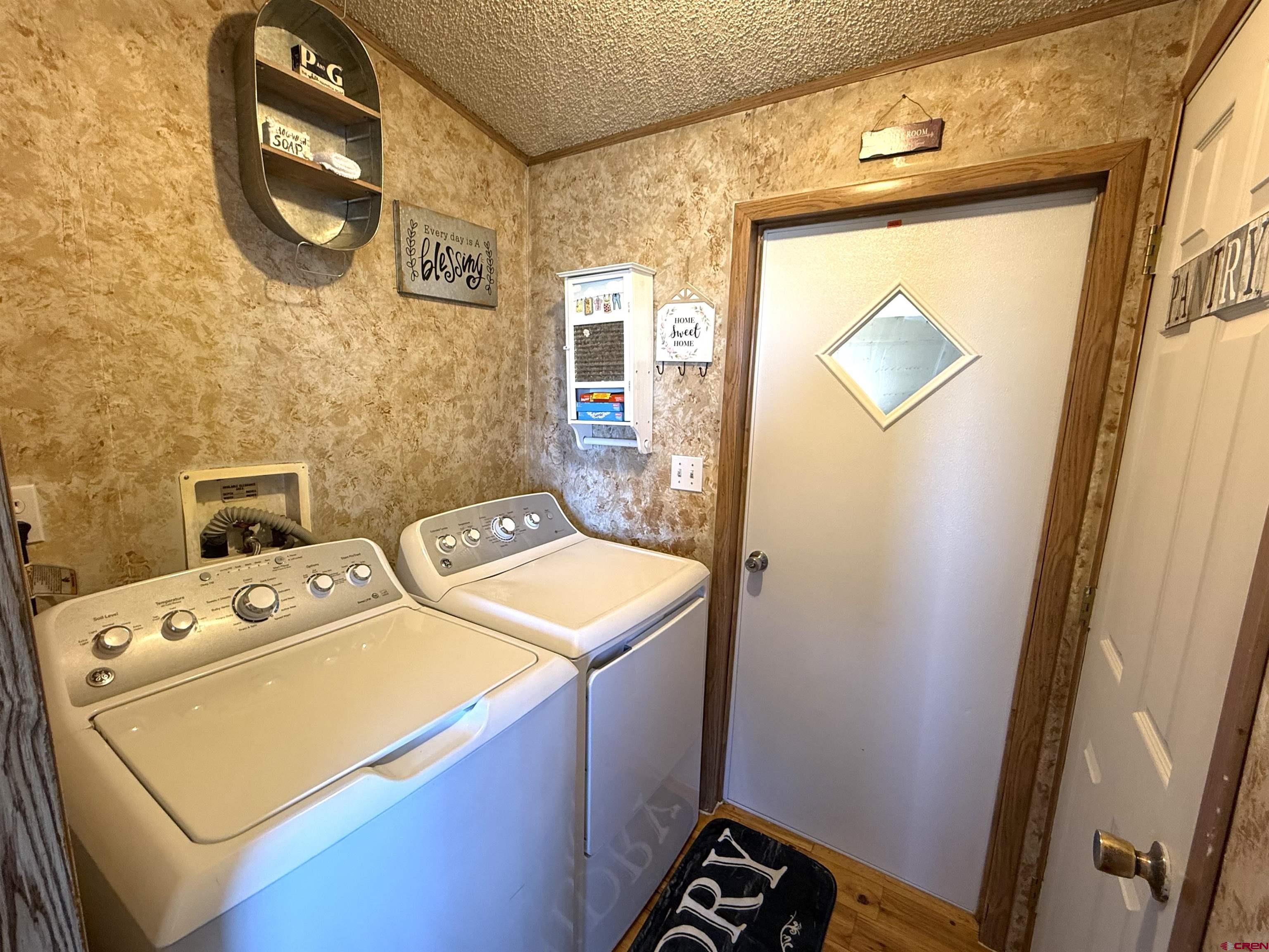 15546 Rd BB Pleasant View, CO 81331 - Photo 18 of 29 a utility room with dryer and washer