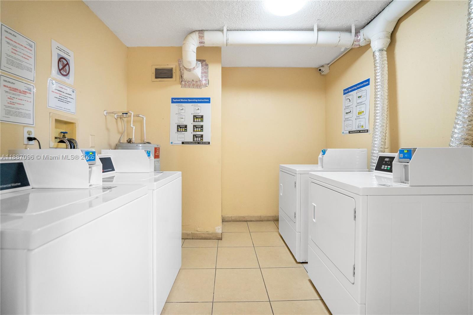 6990 Northwest 186th Street, Unit 4511 Hialeah, FL 33015 - Photo 16 of 29 a utility room with dryer and washer
