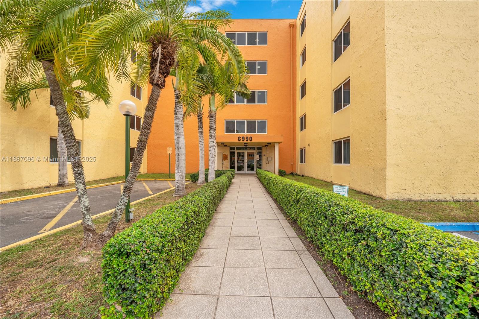 6990 Northwest 186th Street, Unit 4511 Hialeah, FL 33015 - Photo 19 of 29 a view of a pathway with house on both side