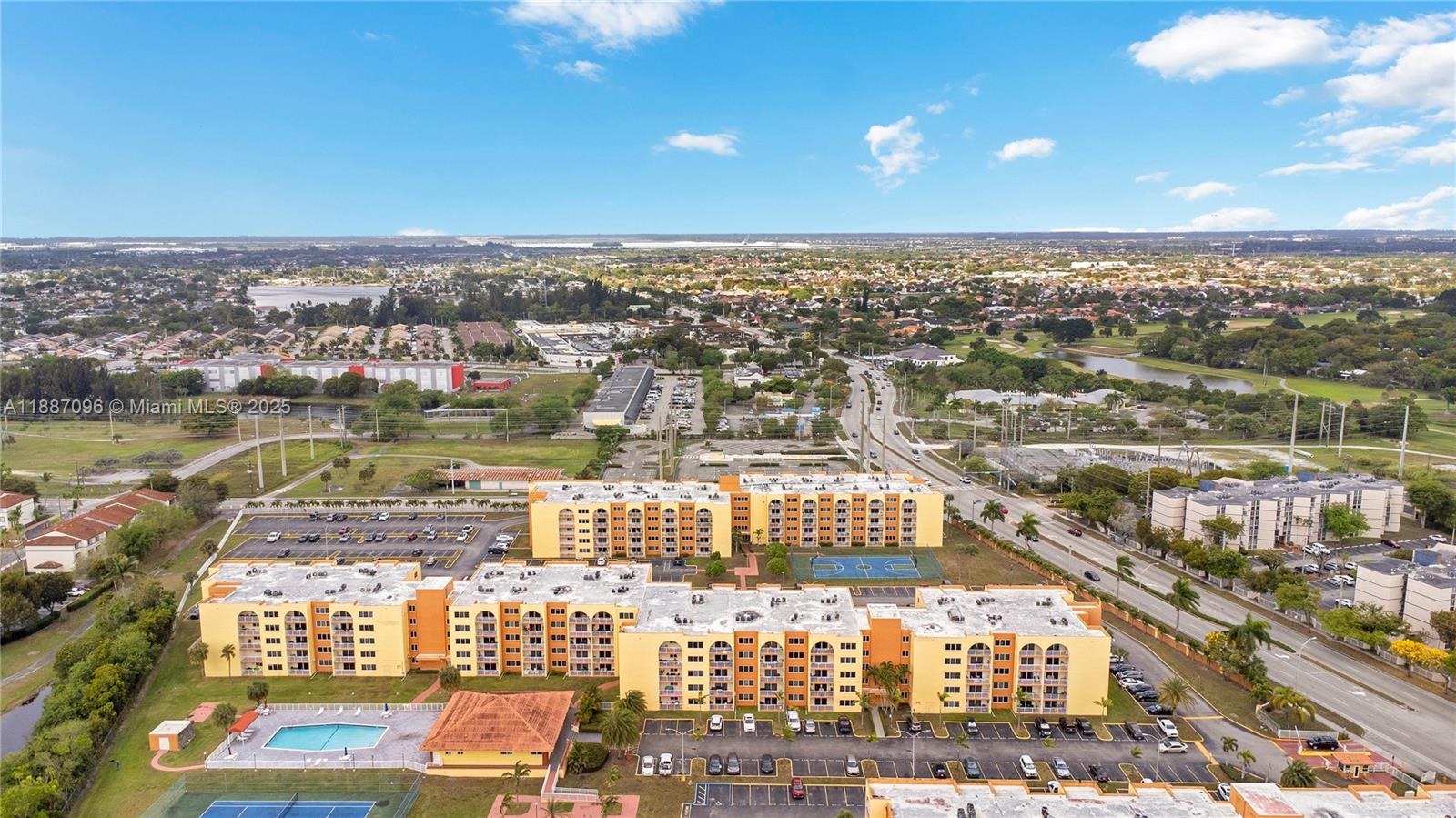 6990 Northwest 186th Street, Unit 4511 Hialeah, FL 33015 - Photo 28 of 29 an aerial view of residential building and lake view