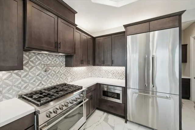 a view of a bedroom with windows and chandelier