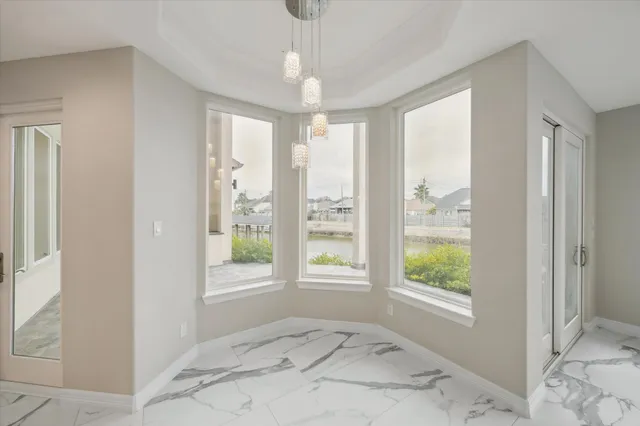 a large bedroom with a large bed and a large window