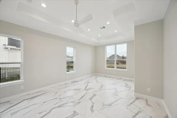 a view of an empty room and wooden floor