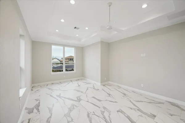 a view of an empty room and wooden floor