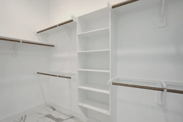 a view of an empty walk in closet