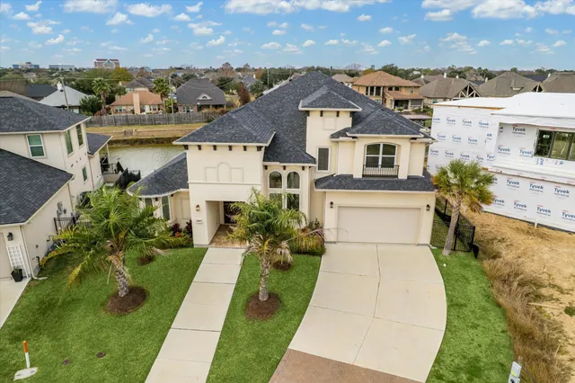 an aerial view of a house with a ocean view