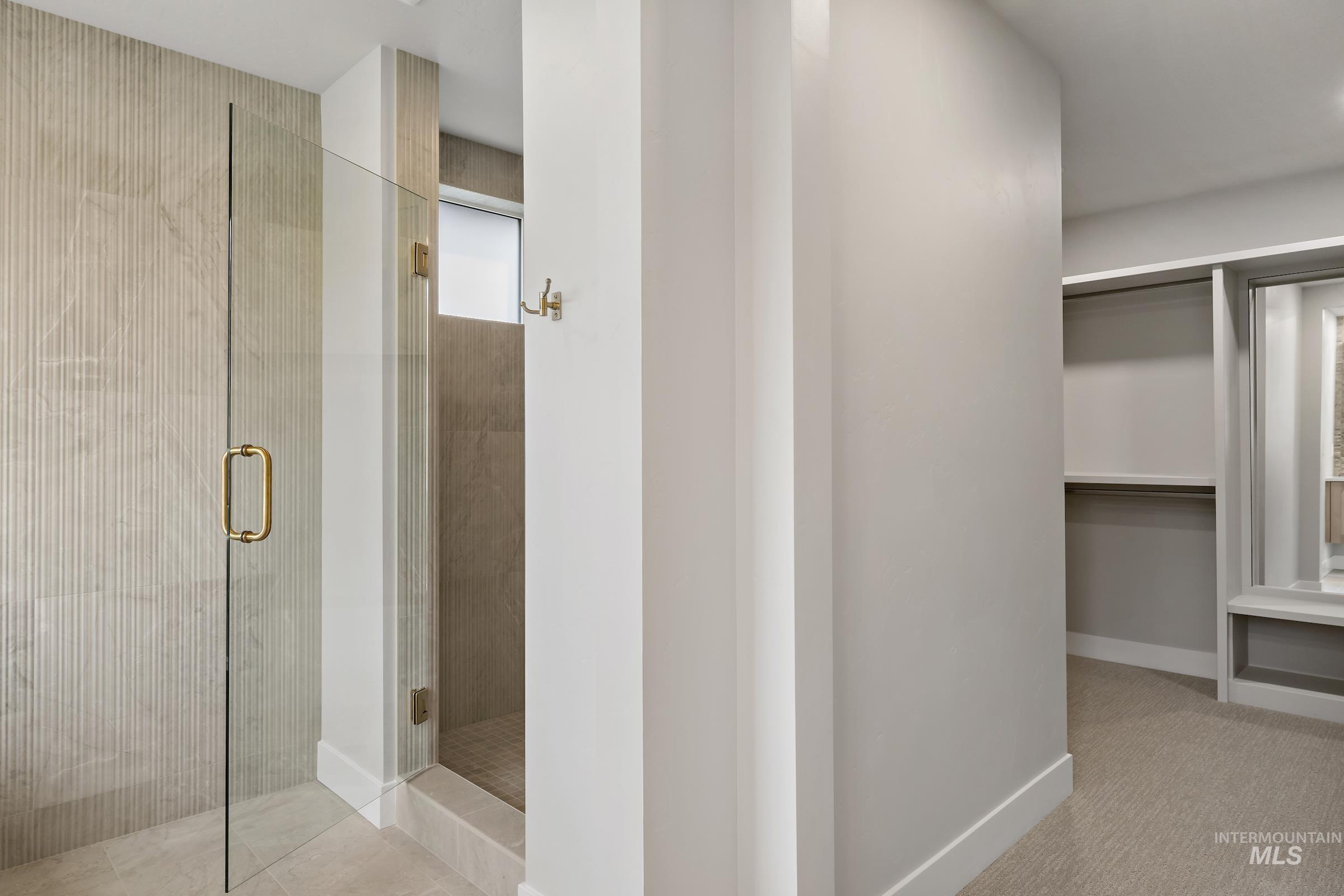 11708 North Rabbitbrush Way Boise, ID 83714 - Photo 22 of 33 Bathroom with a spacious closet and a shower stall