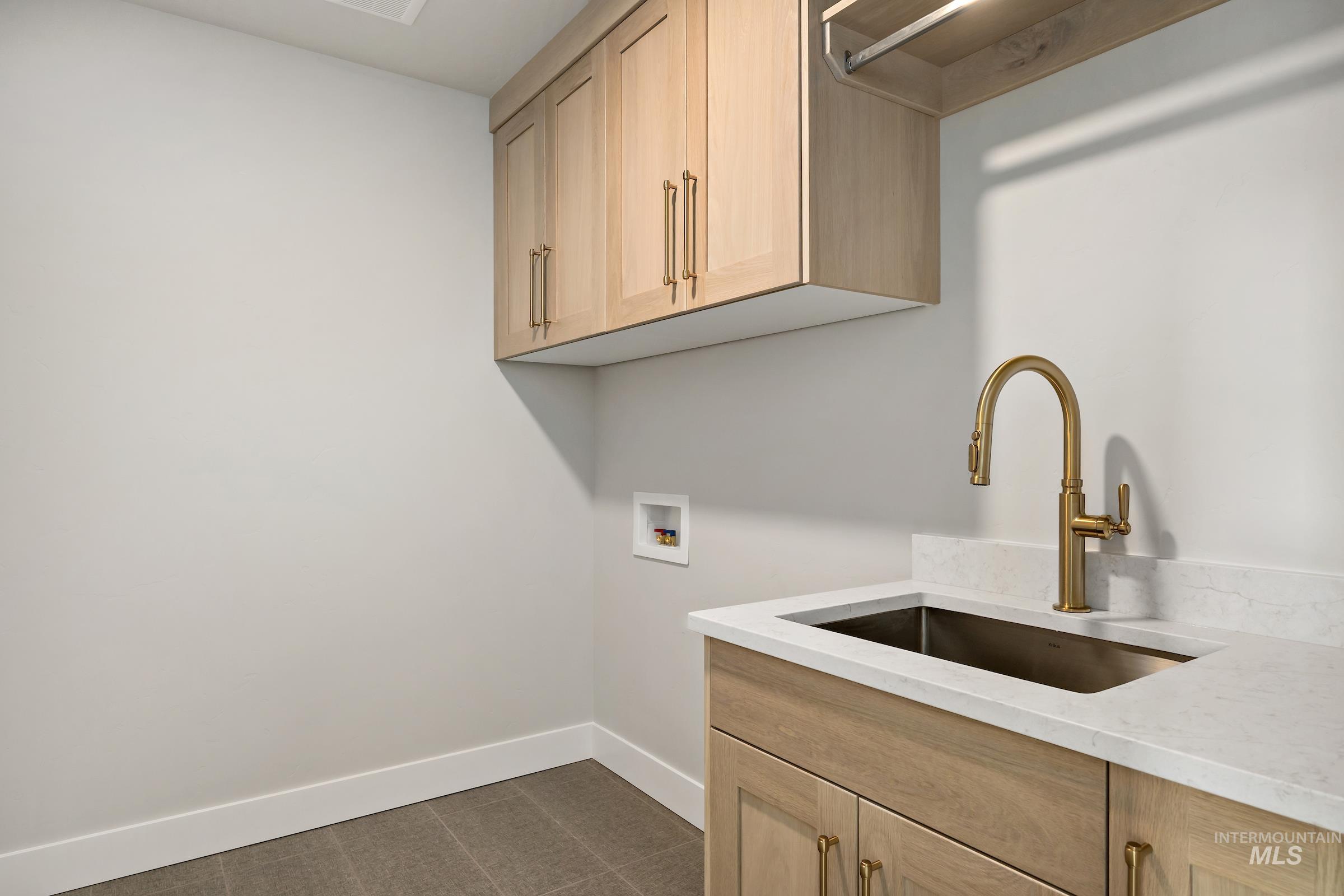 11708 North Rabbitbrush Way Boise, ID 83714 - Photo 24 of 33 Laundry area featuring cabinet space and washer hookup