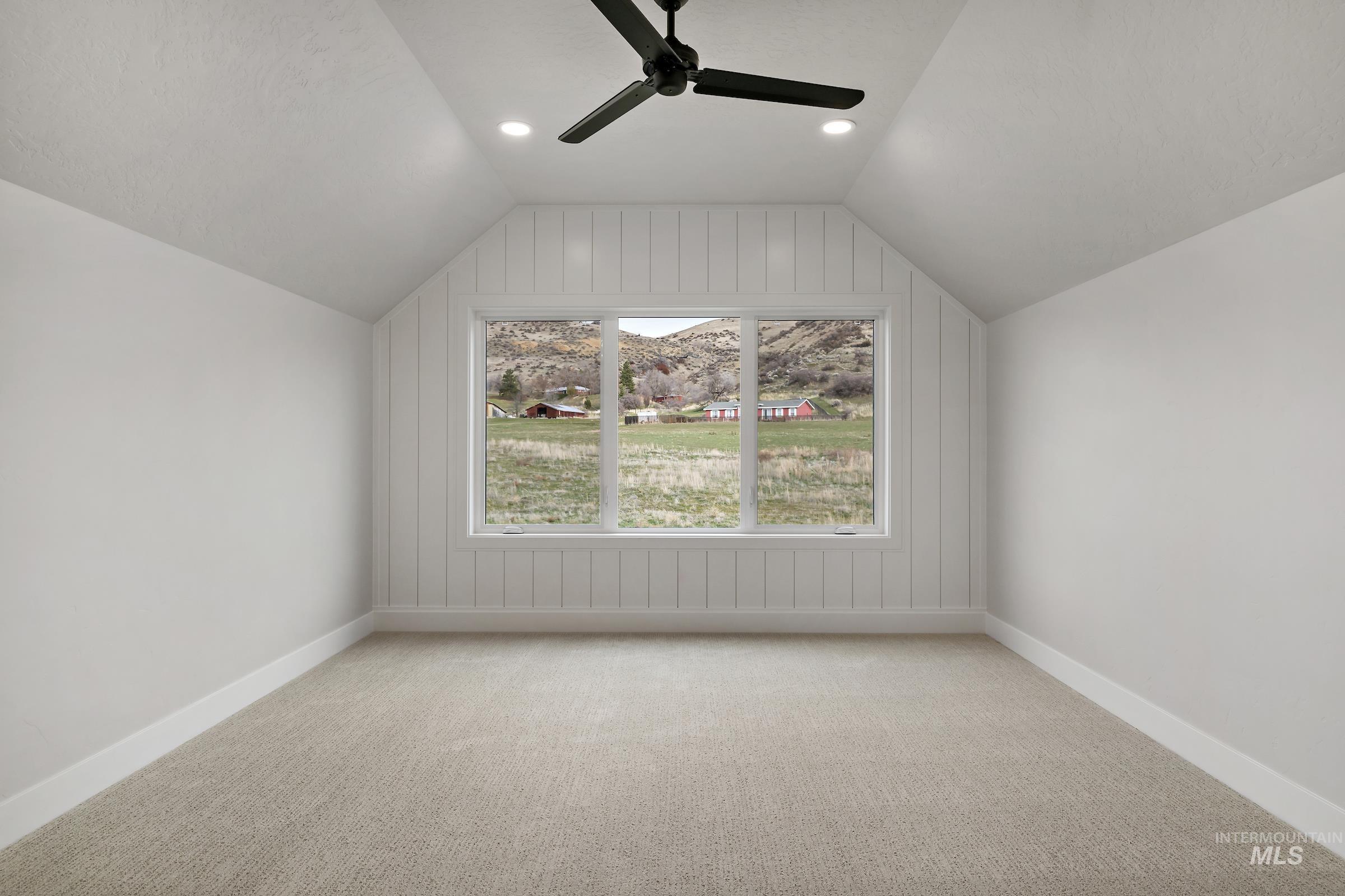 11708 North Rabbitbrush Way Boise, ID 83714 - Photo 29 of 33 Bonus room featuring ceiling fan, carpet, and vaulted ceiling