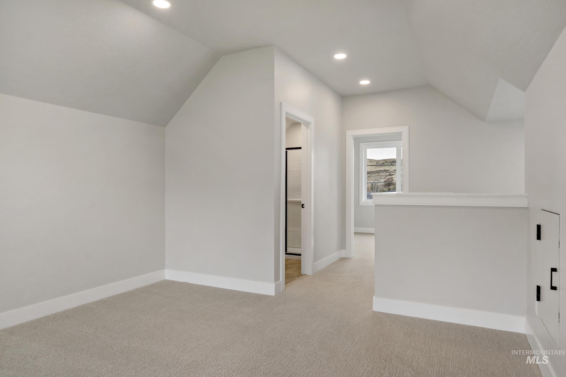 11708 North Rabbitbrush Way Boise, ID 83714 - Photo 30 of 33 Bonus room featuring vaulted ceiling, light colored carpet, and recessed lighting