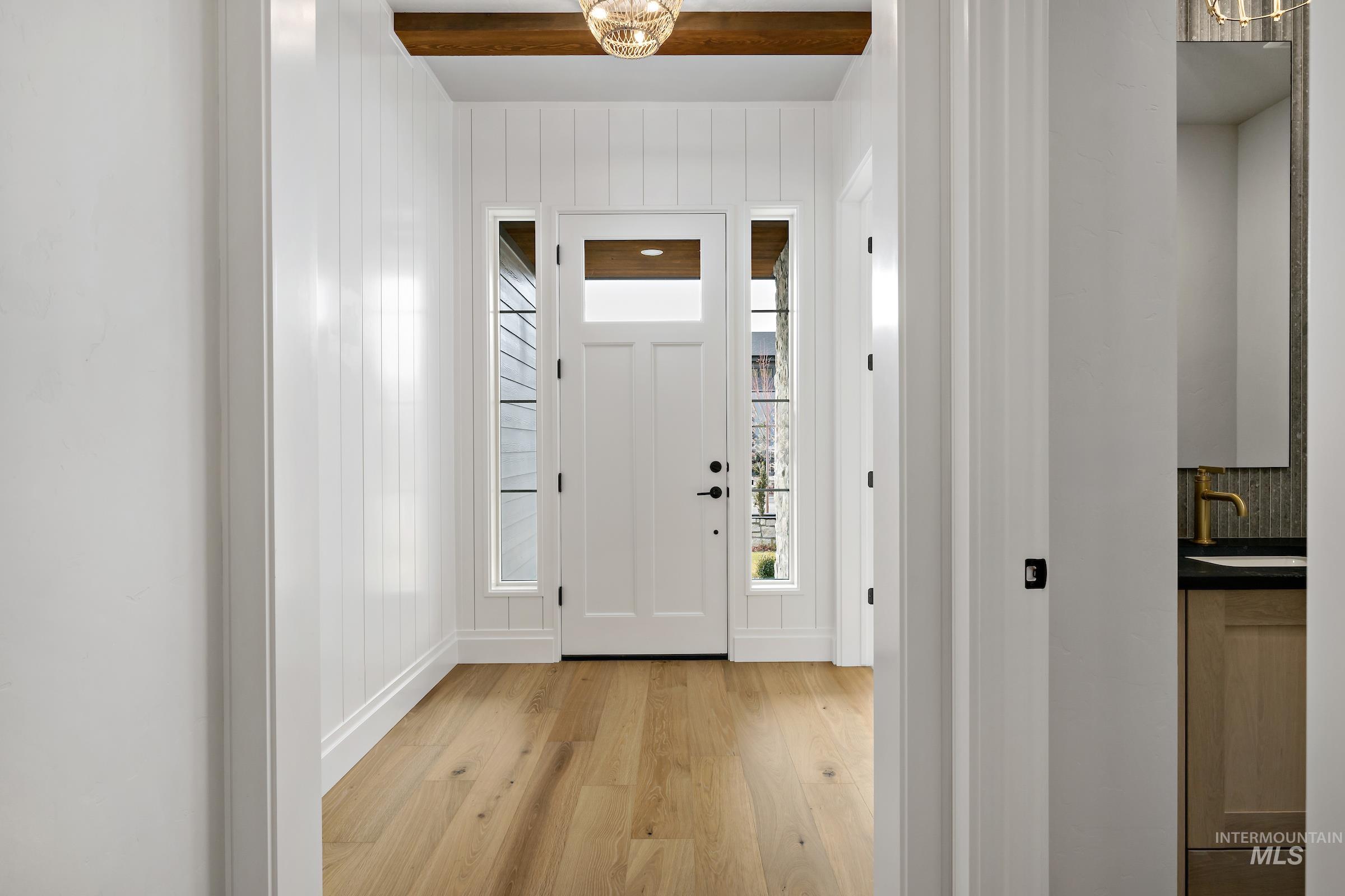 11708 North Rabbitbrush Way Boise, ID 83714 - Photo 5 of 33 Foyer featuring light wood-type flooring and a chandelier