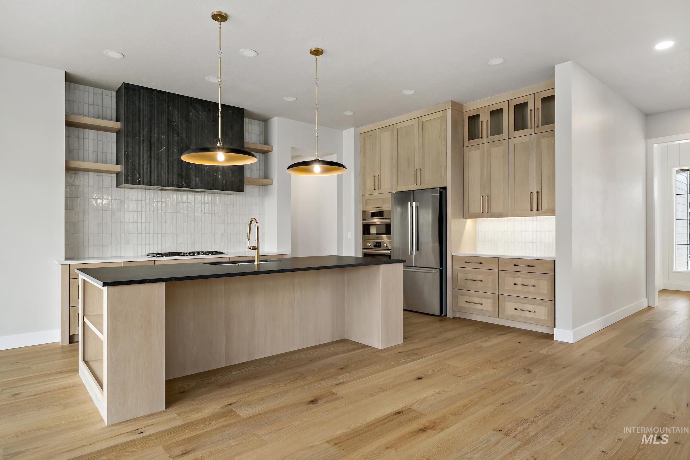 11708 North Rabbitbrush Way Boise, ID 83714 - Photo 7 of 33 Kitchen featuring open shelves, light brown cabinetry, tasteful backsplash, and recessed lighting