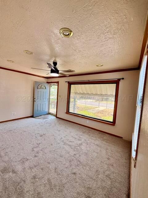 4623 Crockett Street Amarillo, TX 79110 - Photo 6 of 9 a view of an empty room with a window