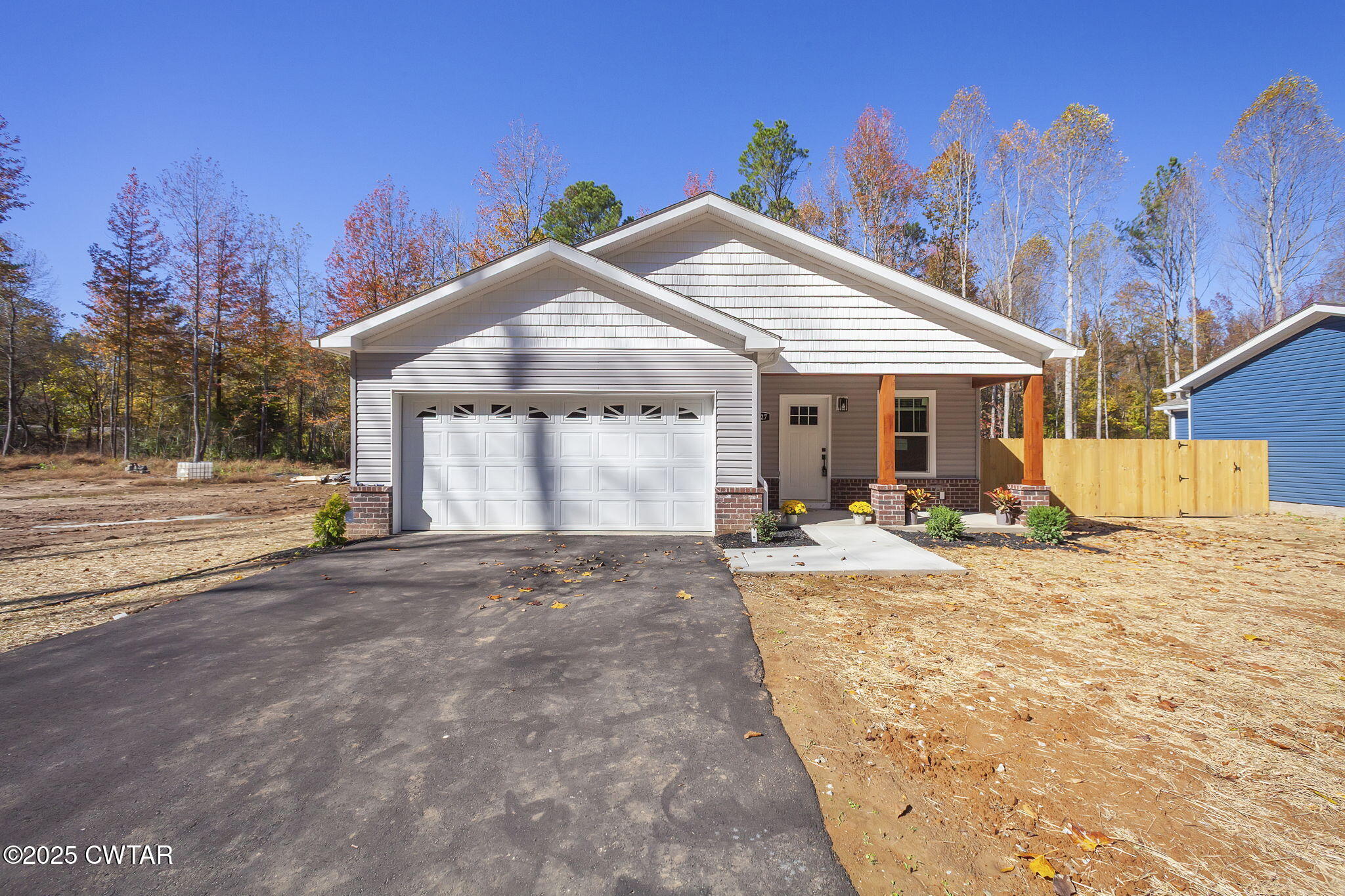 a view of a house with snow on the background