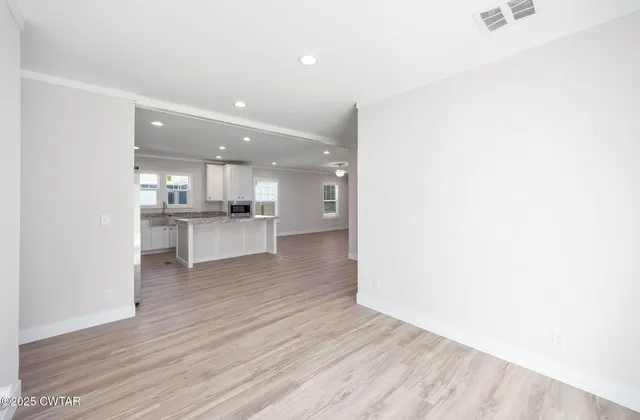 a view of kitchen with wooden floor