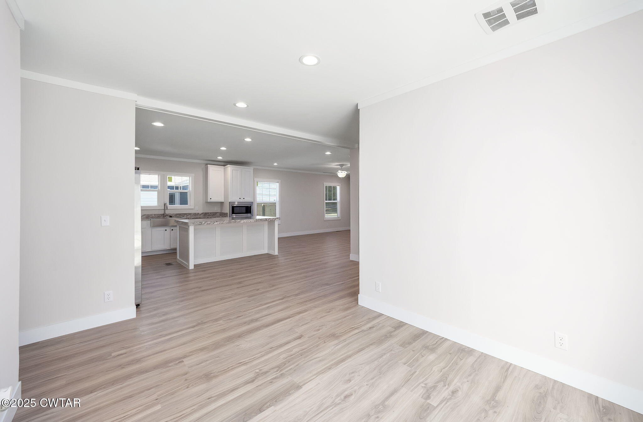 2127 North Royal Street Jackson, TN 38305 - Photo 11 of 26 a view of kitchen with wooden floor