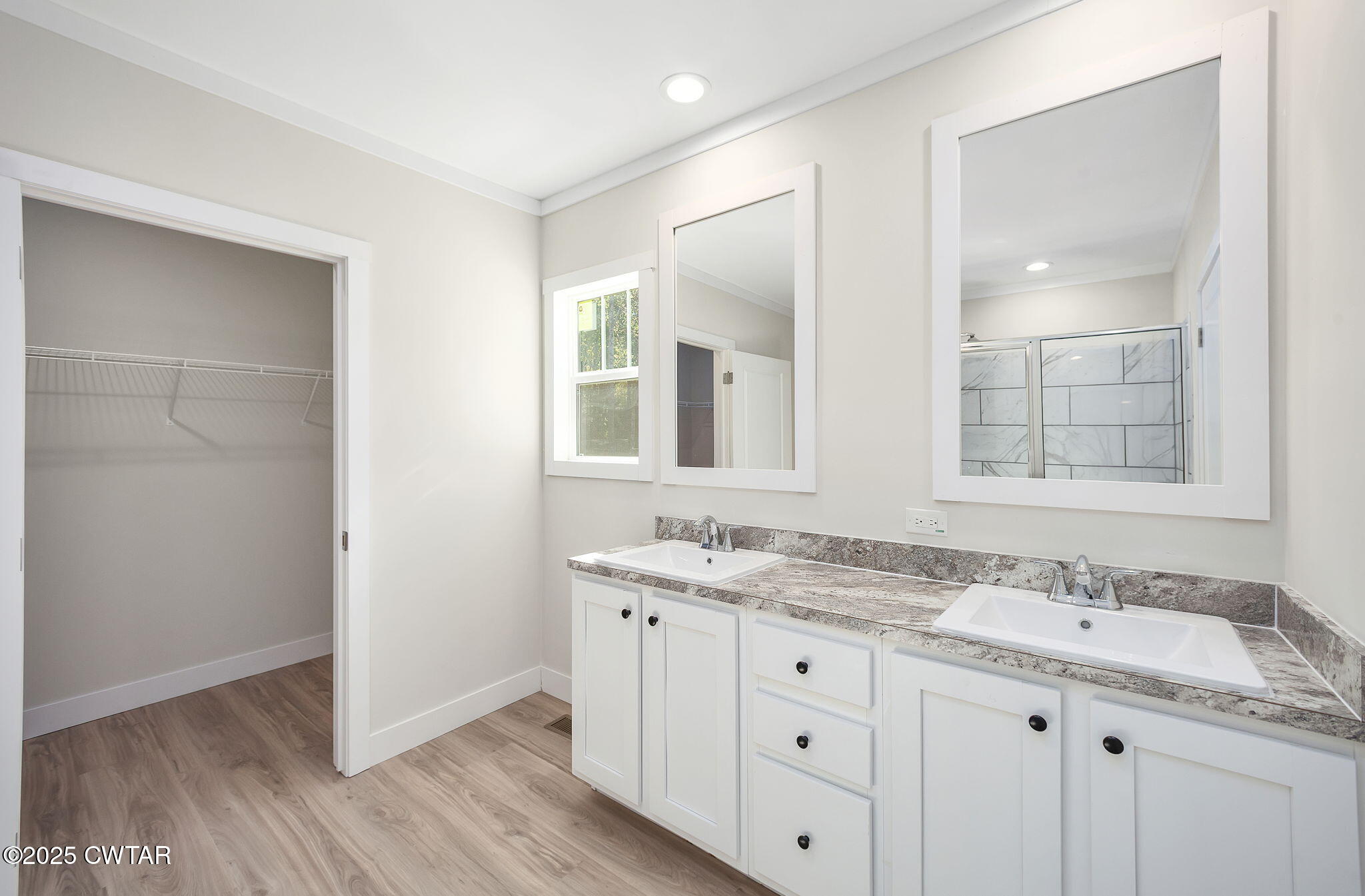2127 North Royal Street Jackson, TN 38305 - Photo 15 of 26 a bathroom with a granite countertop sink double vanity and a mirror