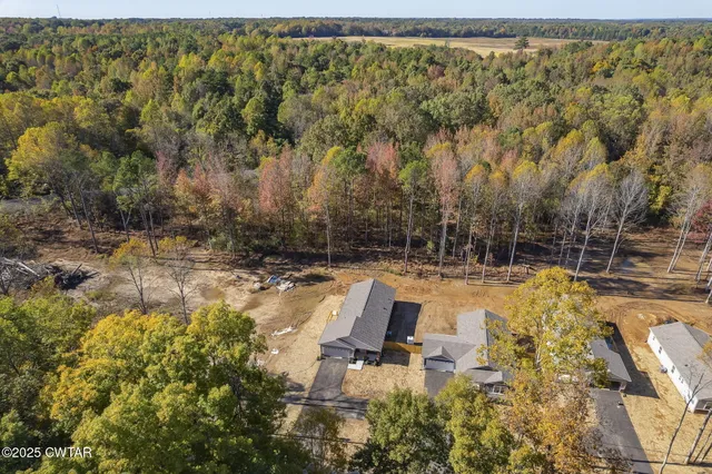 a view of a yard with swimming pool