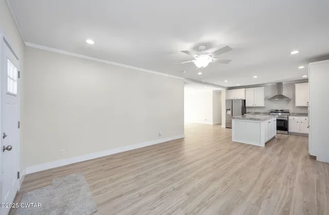a view of kitchen with wooden floor and window