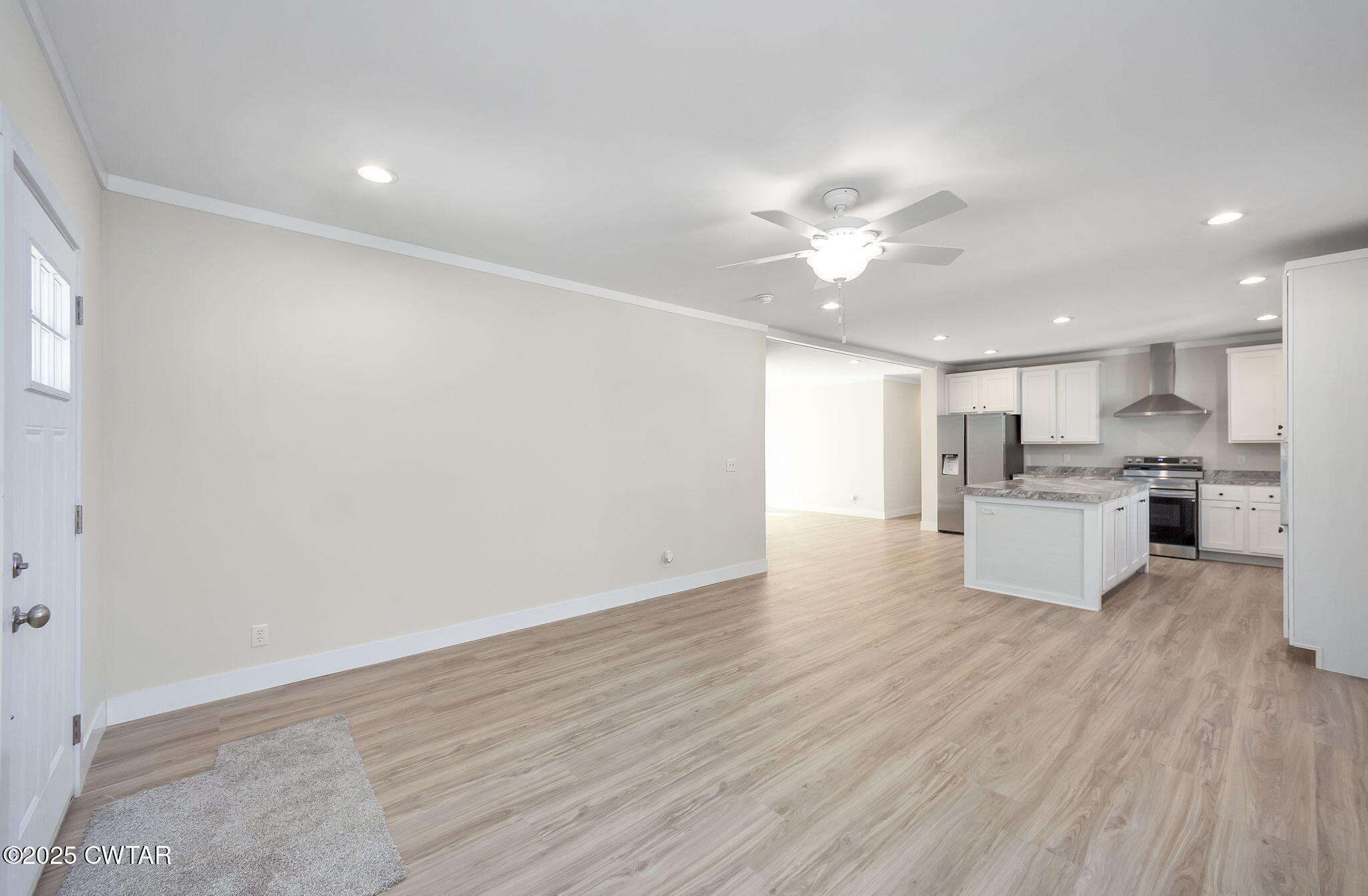 2127 North Royal Street Jackson, TN 38305 - Photo 3 of 26 a view of kitchen with wooden floor and window