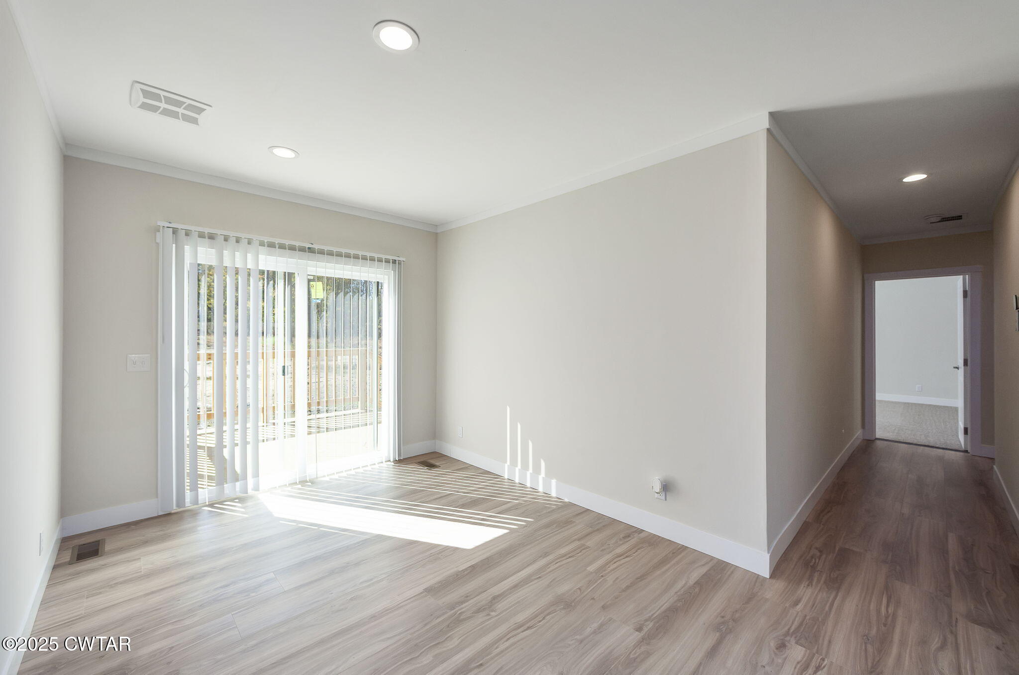 2127 North Royal Street Jackson, TN 38305 - Photo 9 of 26 a view of a livingroom with wooden floor