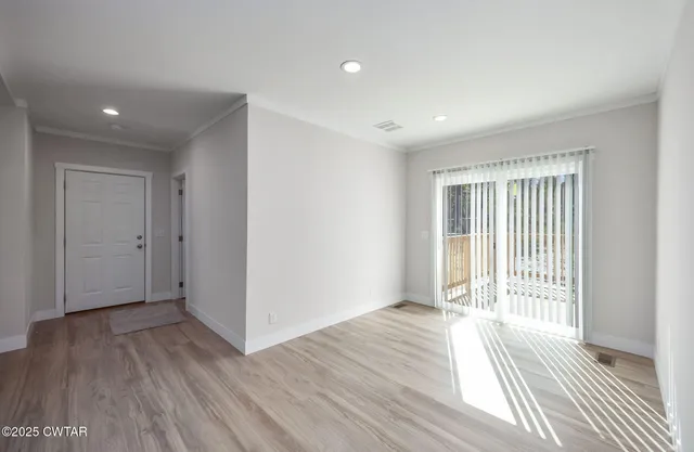 a view of a livingroom with wooden floor