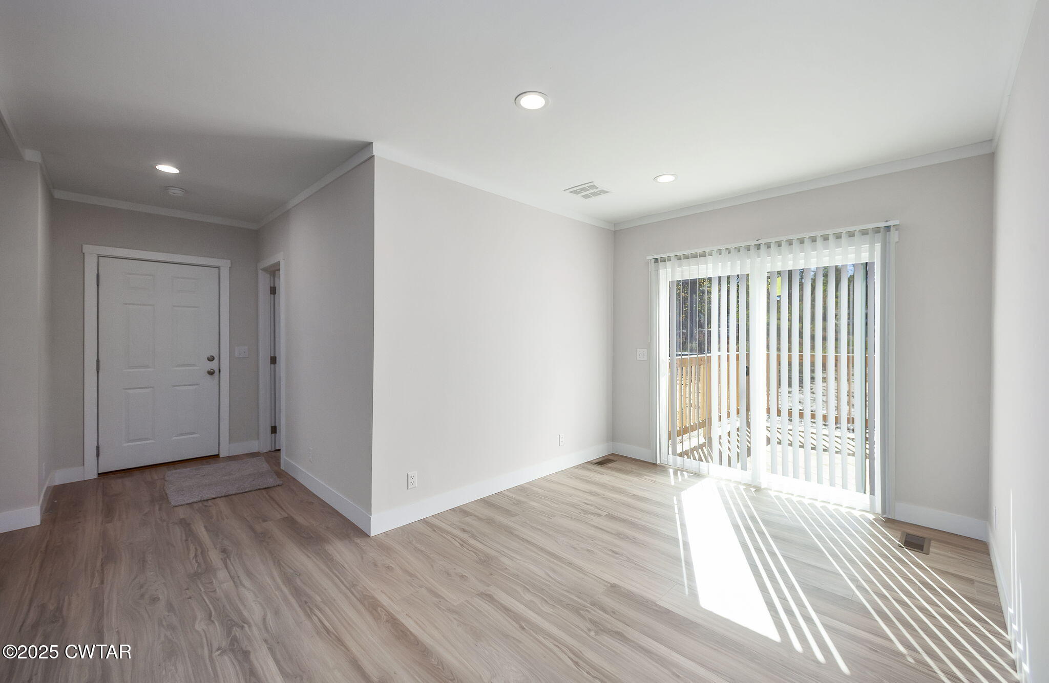2127 North Royal Street Jackson, TN 38305 - Photo 10 of 26 a view of a livingroom with wooden floor