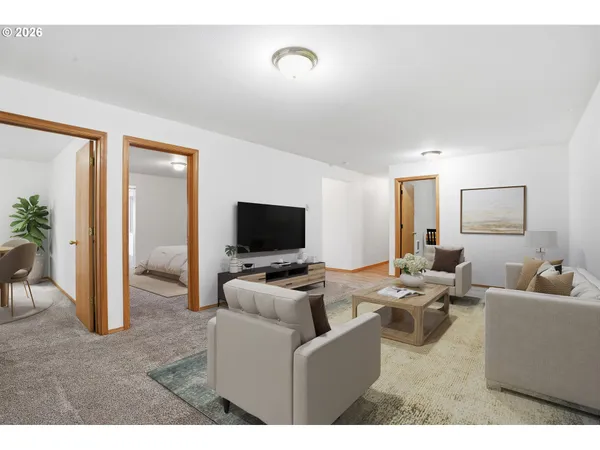 a living room with furniture and a flat screen tv