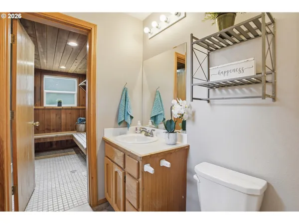 a en suite bathroom with a sink a mirror and a shower