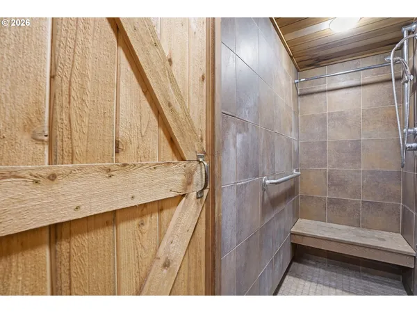 a bathroom with a bathtub and a window