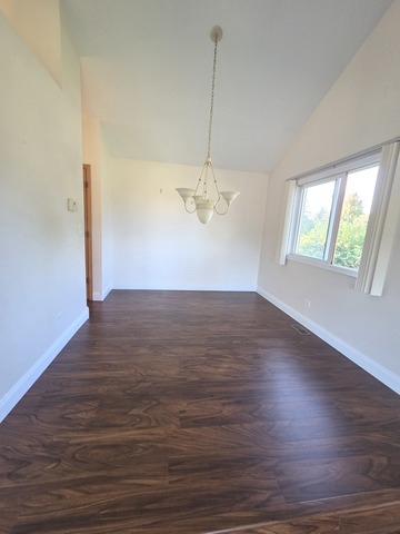 701 Bishops Gate New Lenox, IL 60451 - Photo 13 of 27 an empty room with wooden floor and windows